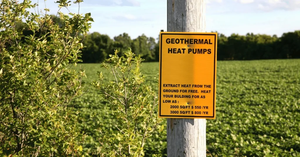 A sign nailed to a post overing Geothermal Heat pump services 