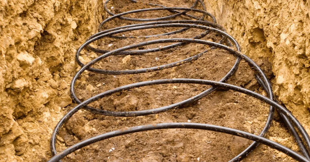 Geothermal piping being laid in the ground 