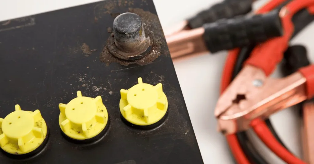 a car battery and jumper cables