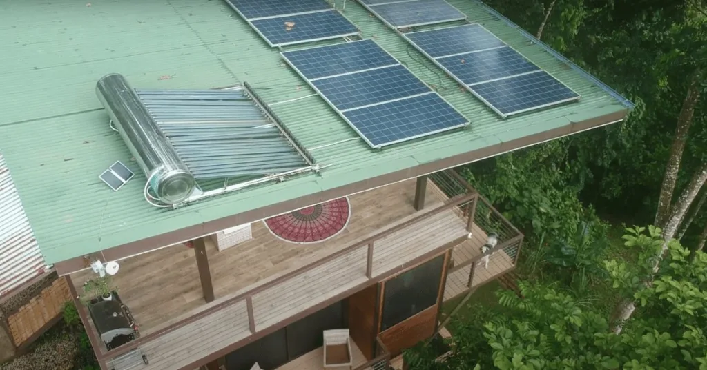 A solar water heater on the roof of an off-grid home