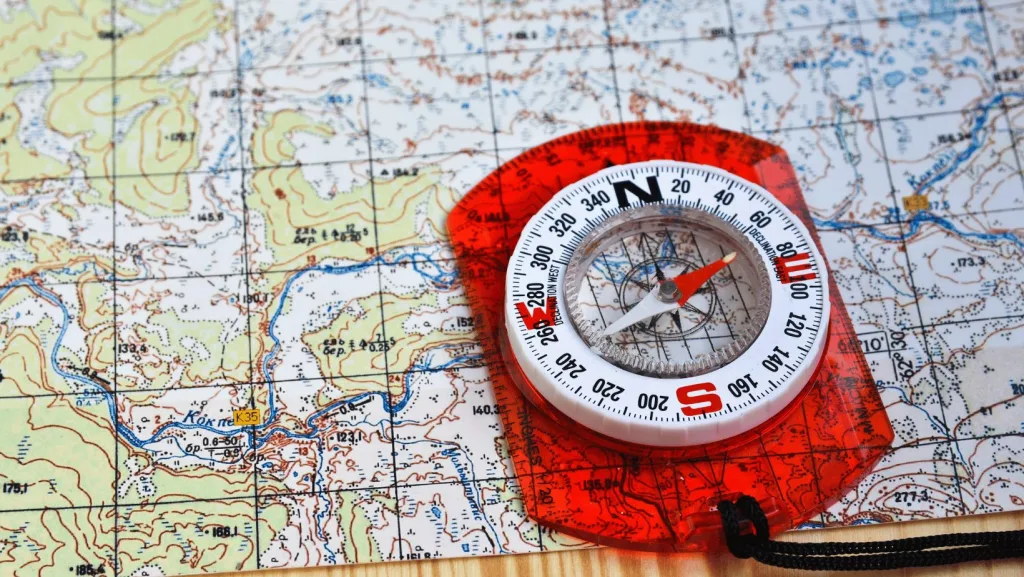 A map and compass used for navigation